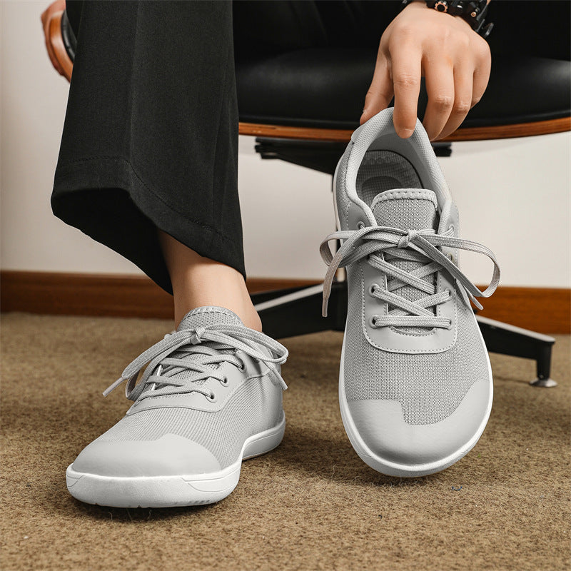 Gray Sneakers Sitting | Joyo Barefoot