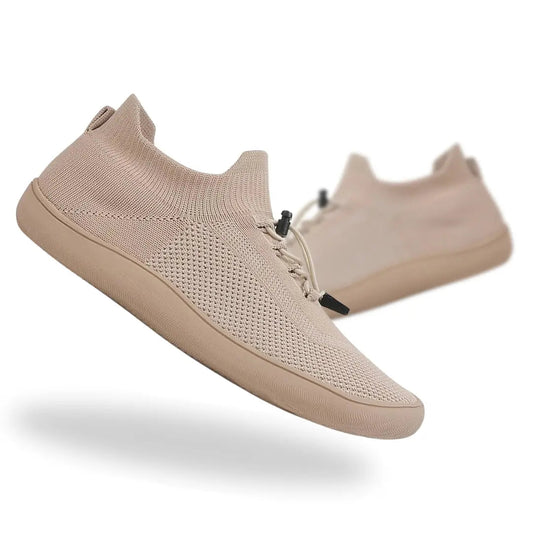 Roamers lightweight barefoot shoes in beige color, designed for optimal comfort and breathability for men and women.