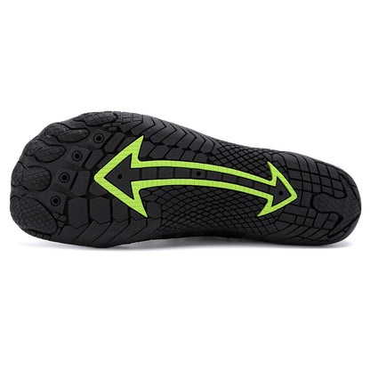 sole of a black and green shoe with an arrow—Joyo barefoot